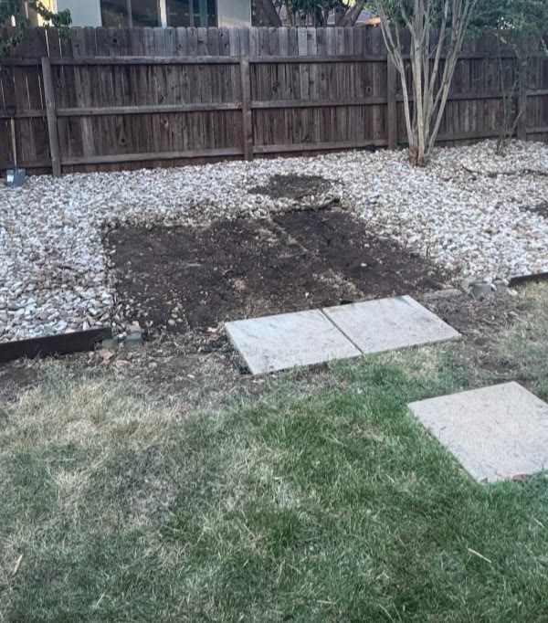 The same backyard cleared after Affordable Junk Removal demolished the shed and hauled off the debris