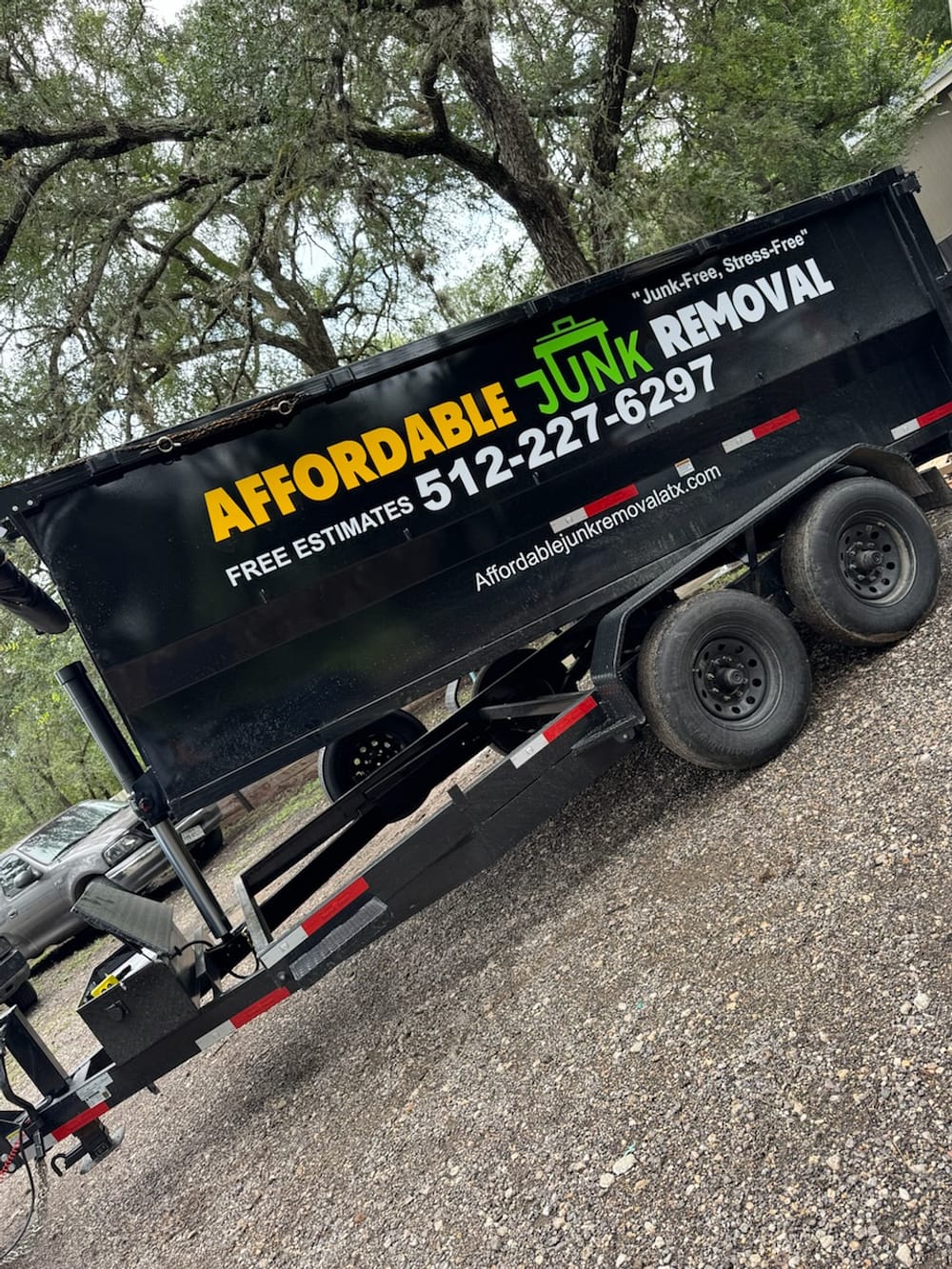 Affordable Junk Removal branded dump trailer for same-day junk removal and hauling in Austin, TX